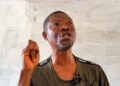 Yekeh Kolubah speaking at his Old Road residence in Monrovia.