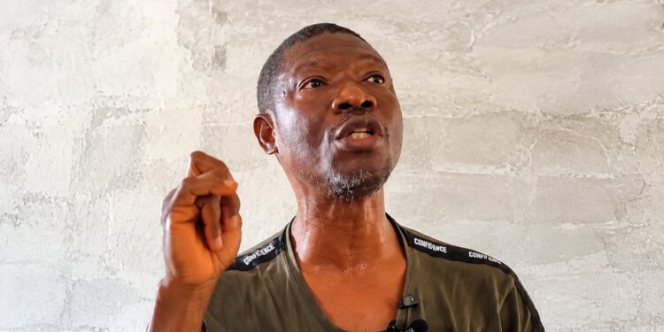 Yekeh Kolubah speaking at his Old Road residence in Monrovia.