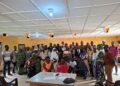 Participants and CJPS executives pose for a group photograph at a meeting in Gbarnga.