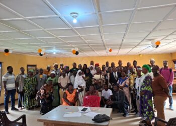 Participants and CJPS executives pose for a group photograph at a meeting in Gbarnga.