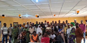 Participants and CJPS executives pose for a group photograph at a meeting in Gbarnga.