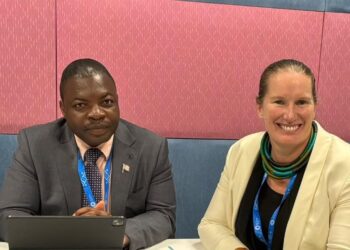 NaFAA Director General J. Cyrus Saygbe Sr., left, and World Bank official Valerie Hickey.