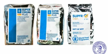 Packages labeled Super Cereal Plus nutritional cereal.